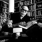 Dalton Trumbo in his office with his collection of Pre-Columbian art, 1961.