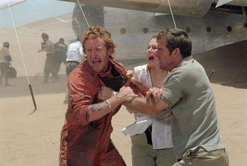 Emotions and tensions run high for passengers of a downed plane lost in the desert, including, left to right: Tony Curran as Rodney, Miranda Otto as Kelly, and Dennis Quaid as Towns.  