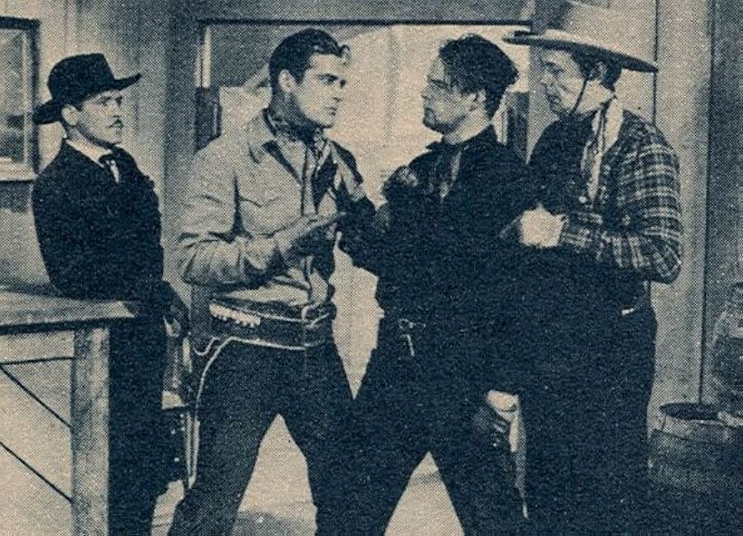 Dick Curtis, Kenneth MacDonald, Charles Starrett, and Francis Walker in Bullets for Rustlers (1940)