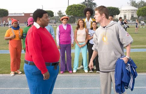 Arthur (J. Mack Slaughter, Jr. right) confronts Fat Albert (Kenan Thompson) on the track.  Observing in the background are (L-R) Mushmouth (Jermaine Williams), Dumb Donald (Marques B. Houston), Rudy (Shedrack Anderson III), Lauri (Dania Ramirez), Old Weird Harold (Aaron A. Frazier), Doris (Kyla Pratt) and Bucky (Alphonso McAuley).