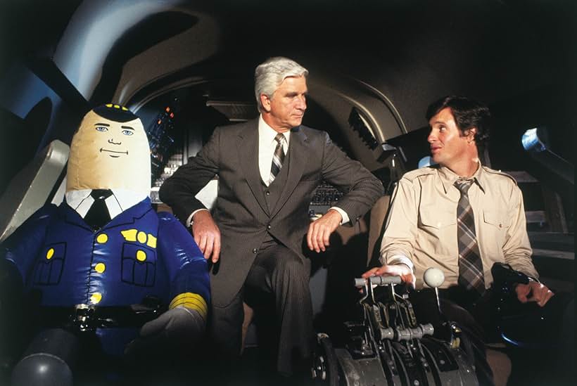 Leslie Nielsen, Robert Hays, and Otto in Airplane! (1980)