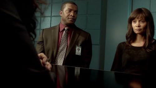 Roger Cross and Thandiwe Newton in Rogue (2013)