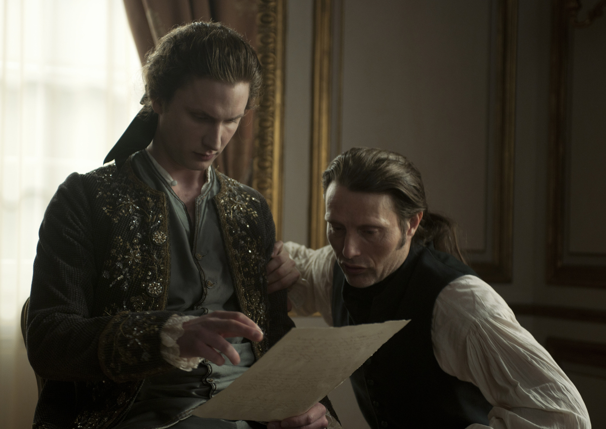 Mads Mikkelsen and Mikkel Boe Følsgaard in A Royal Affair (2012)