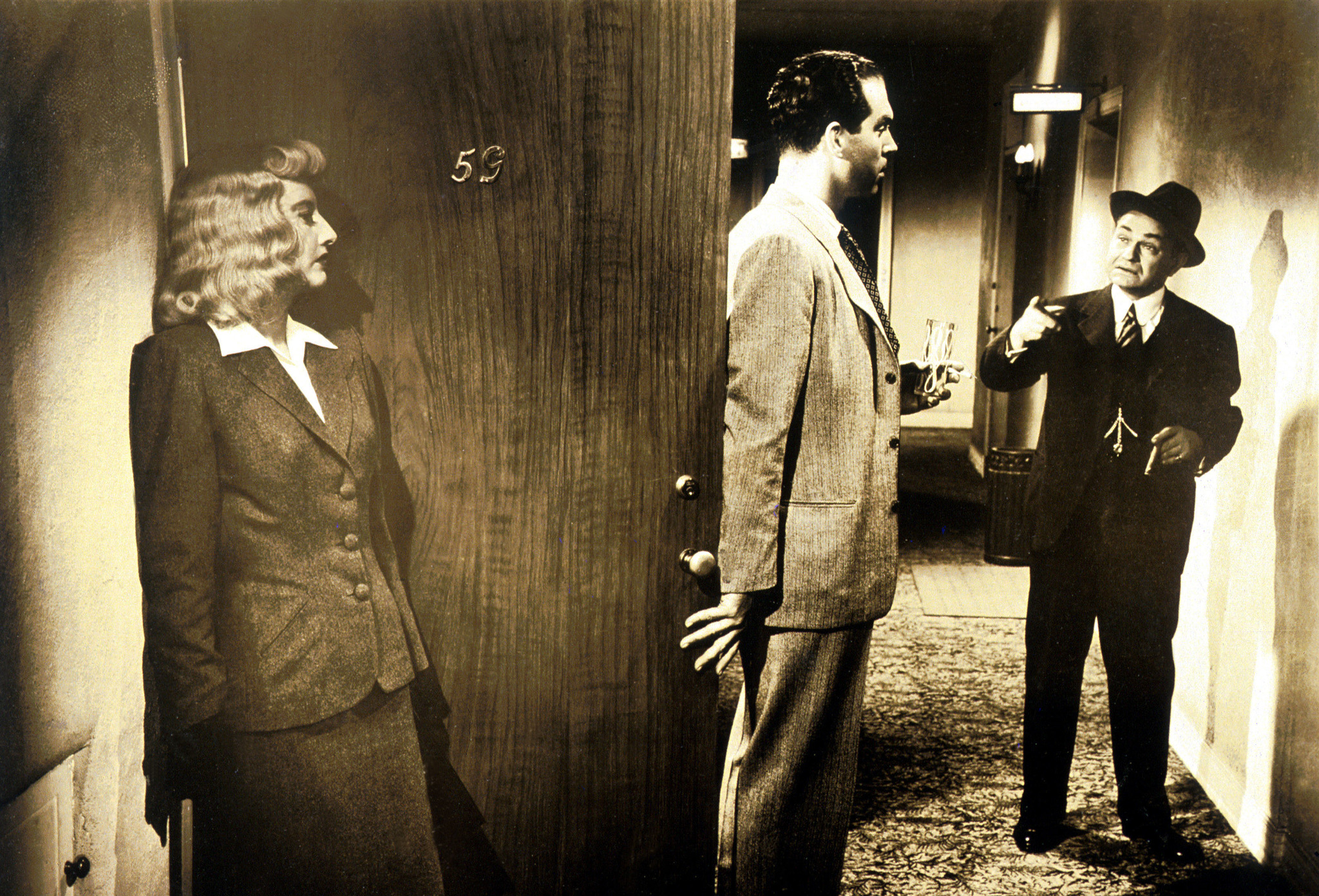 Edward G. Robinson, Barbara Stanwyck, and Fred MacMurray in Double Indemnity (1944)