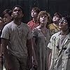 Wyatt Oleff, Jeremy Ray Taylor, Jaeden Martell, Finn Wolfhard, Sophia Lillis, Jack Dylan Grazer, and Chosen Jacobs in It (2017)