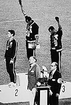 John Carlos, Peter Norman, and Tommie Smith in 1968 with Tom Brokaw (2007)