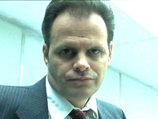 Tim Kelleher as Bishop in Matchstick Men.