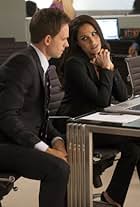 Patrick J. Adams and Meghan Markle in Suits (2011)