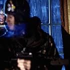 Marvin Campbell is the infected peering through the window at Luke Mably (front).