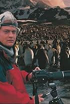 Jason Roberts with King Penguins on the island of South Georgia, sub Antarctica.