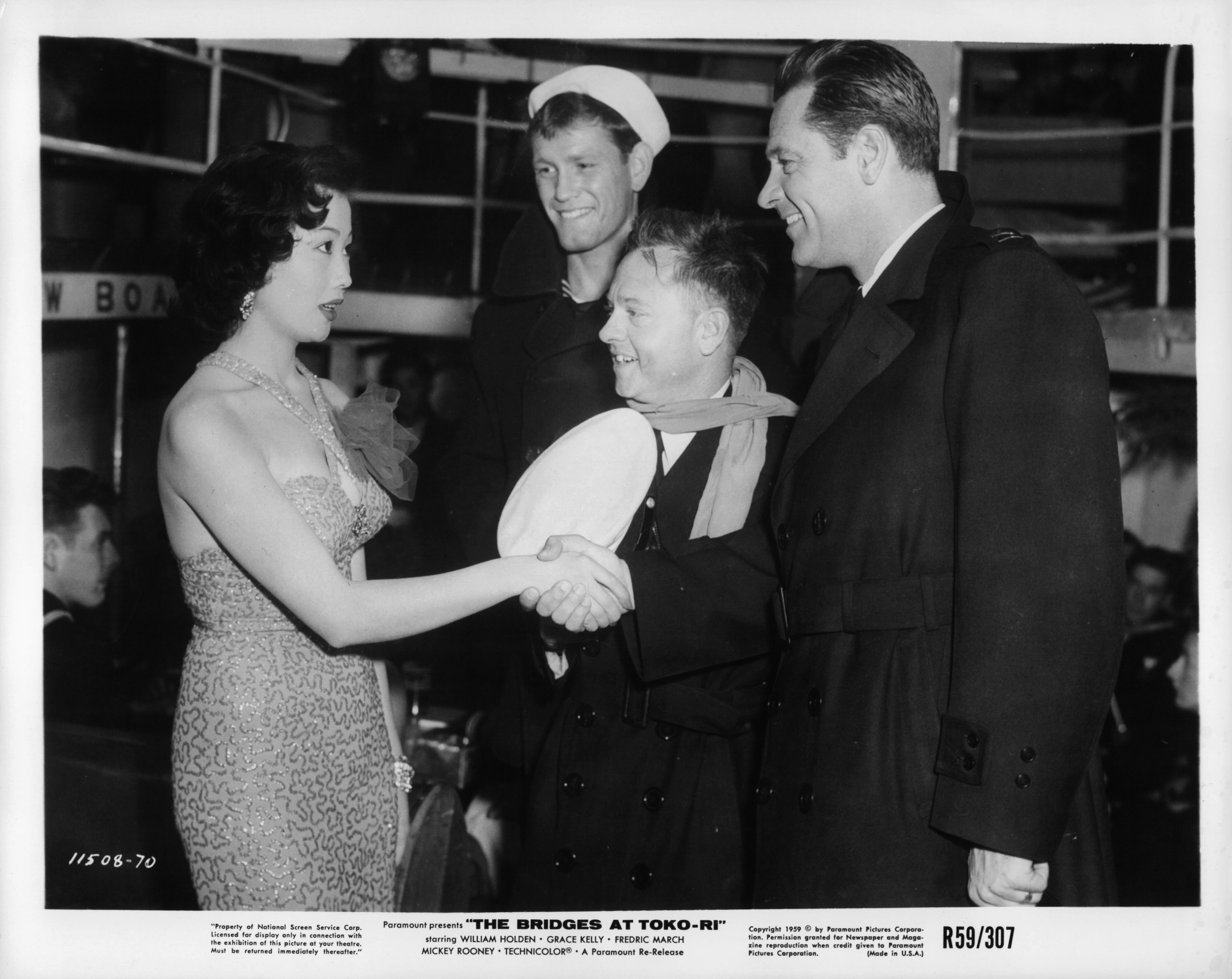 William Holden, Mickey Rooney, Keiko Awaji, and Earl Holliman in The Bridges at Toko-Ri (1954)