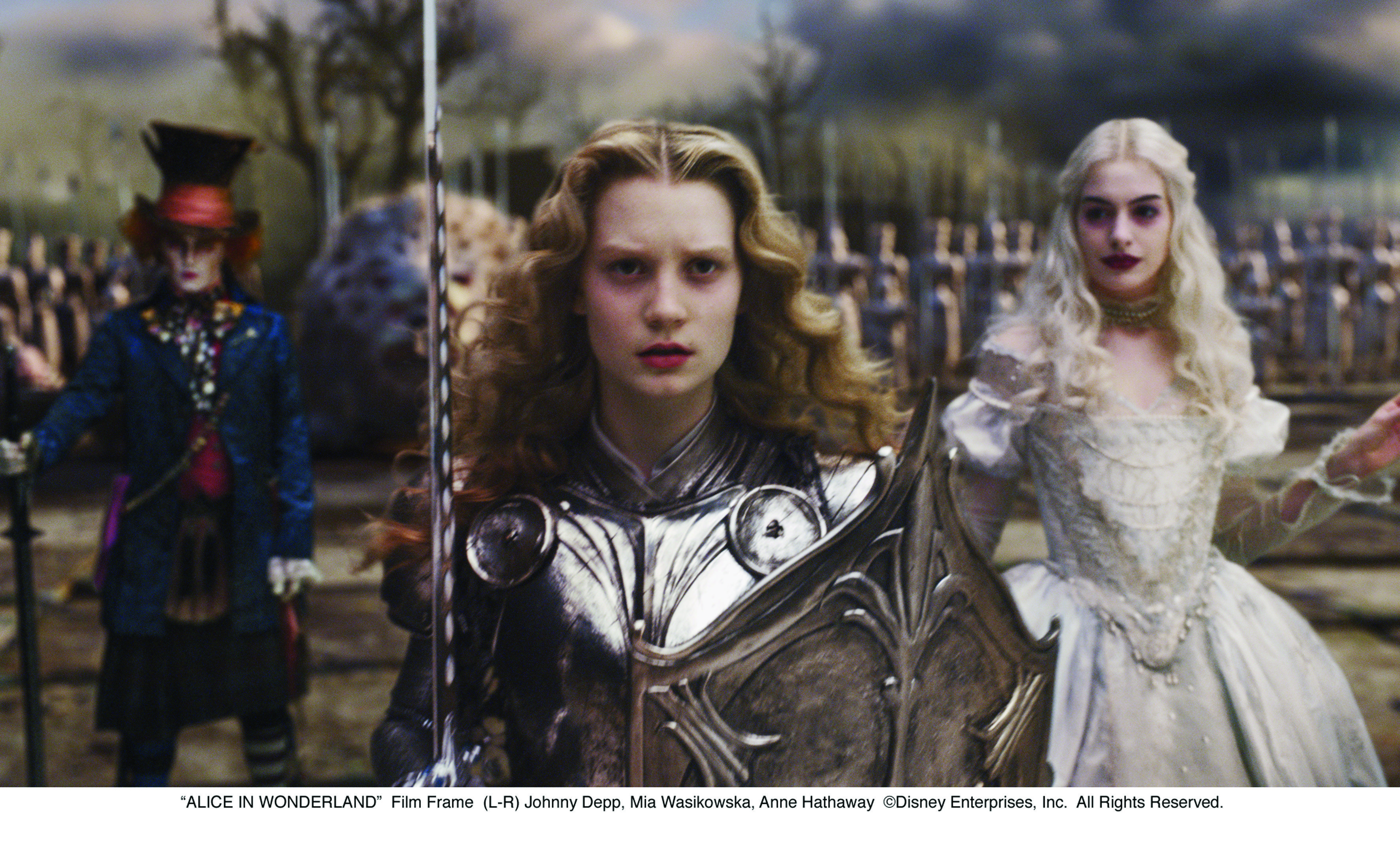 Johnny Depp, Anne Hathaway, and Mia Wasikowska in Alice in Wonderland (2010)