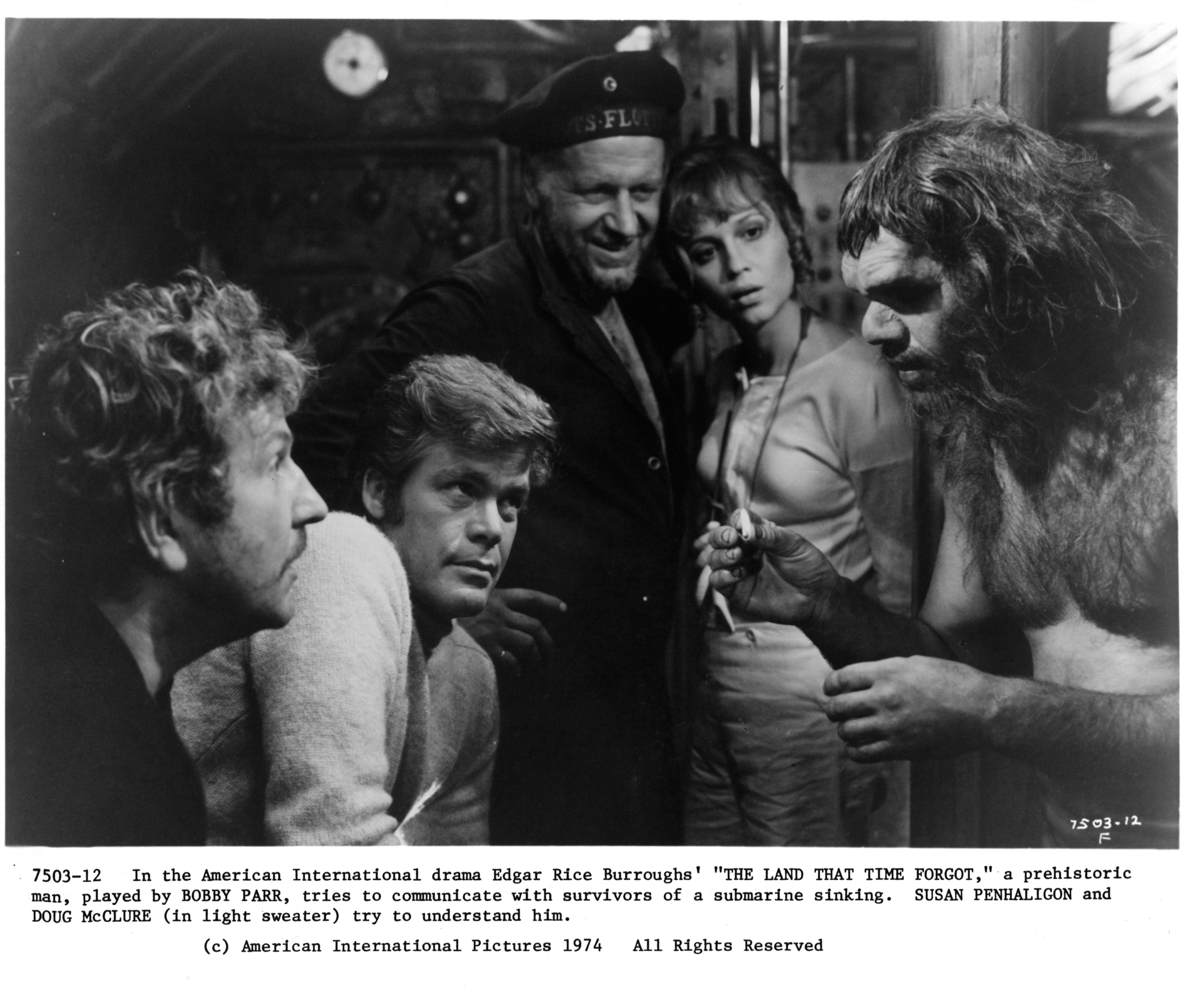 Keith Barron, Godfrey James, Doug McClure, Bobby Parr, and Susan Penhaligon in The Land That Time Forgot (1974)