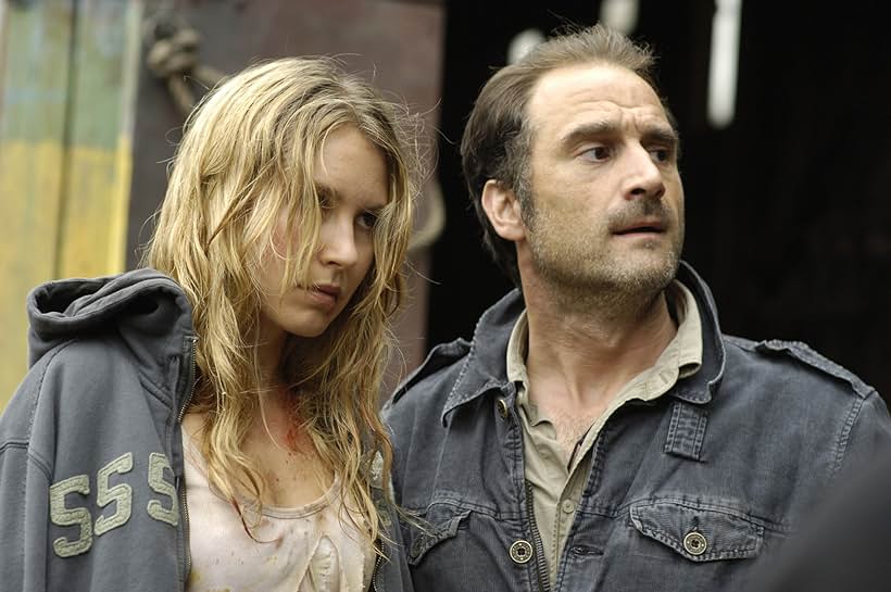 Elias Koteas and Sarah Carter in Skinwalkers (2006)