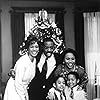 Whitney Houston, Courtney B. Vance, Darvel Davis Jr., Justin Pierre Edmund, and Jenifer Lewis in The Preacher's Wife (1996)