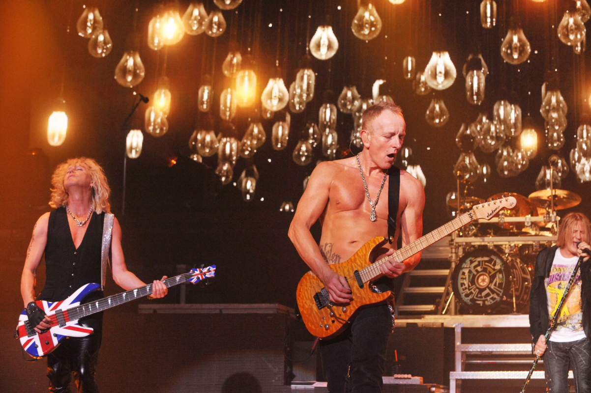 Rick Savage, Phil Collen, and Def Leppard in Def Leppard Viva! Hysteria Concert (2013)