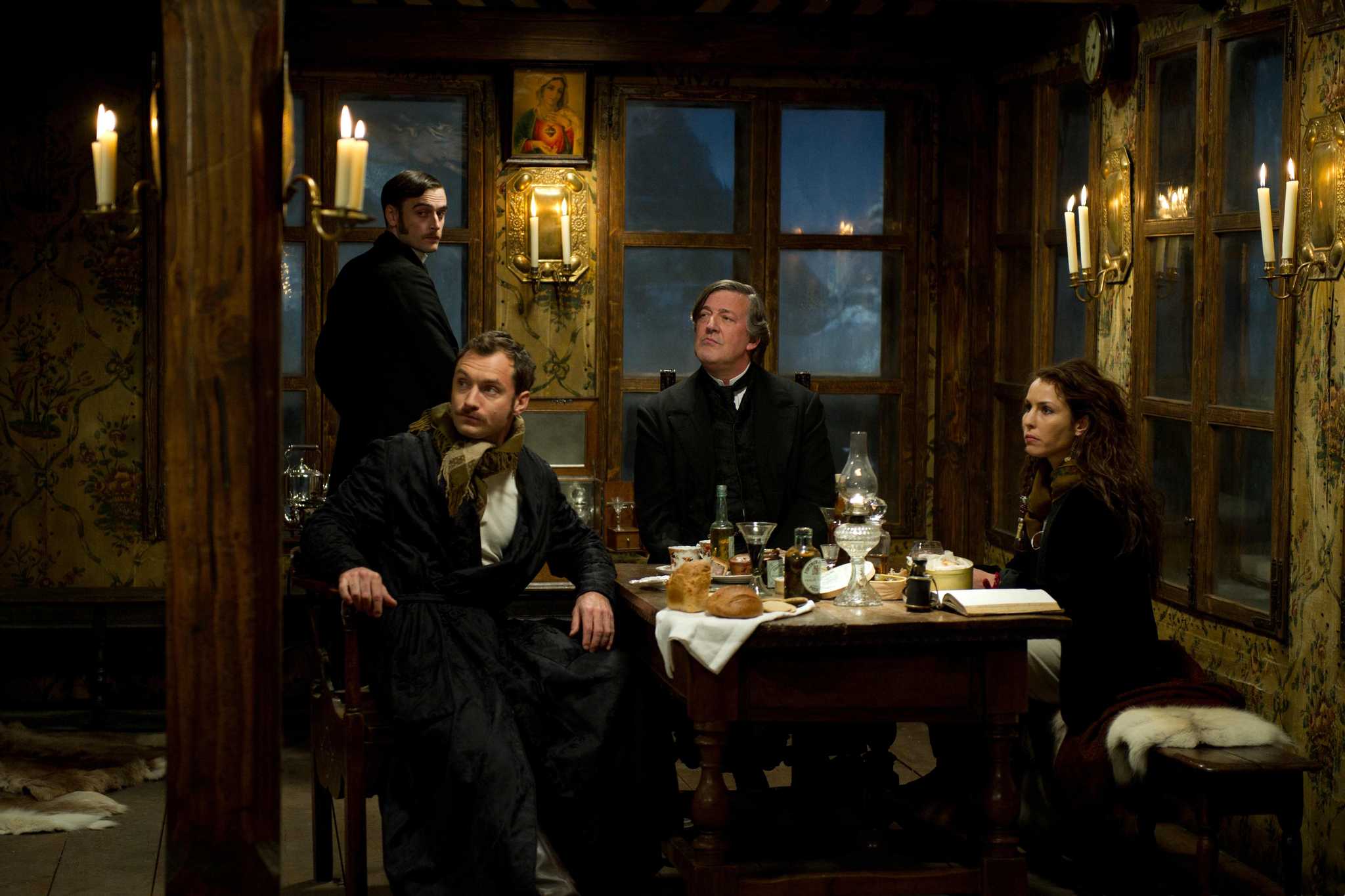 Jude Law, Stephen Fry, Noomi Rapace, and Jack Laskey in Sherlock Holmes: A Game of Shadows (2011)