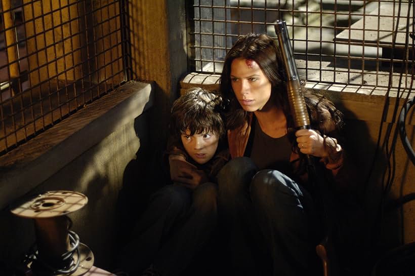 Rhona Mitra and Matthew Knight in Skinwalkers (2006)