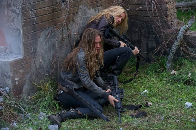 Elizabeth Mitchell and Tracy Spiridakos in Revolution (2012)