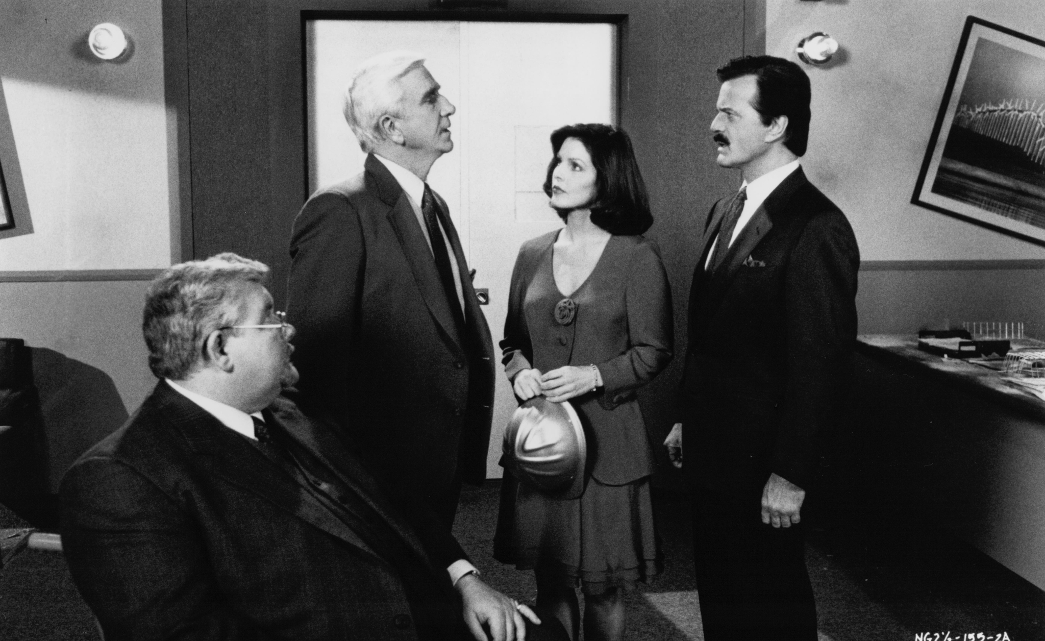 Leslie Nielsen, Priscilla Presley, Robert Goulet, and Richard Griffiths in The Naked Gun 2½: The Smell of Fear (1991)