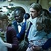 Brad Pitt, Mireille Enos, Fana Mokoena, and Sterling Jerins in World War Z (2013)