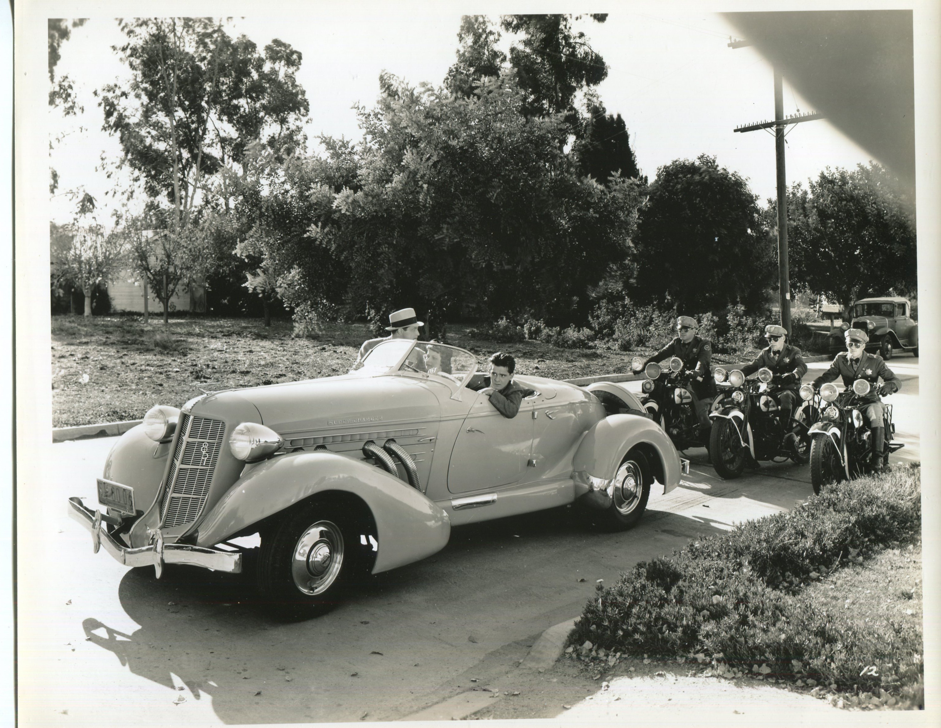 Frankie Darro, Muriel Evans, and Kane Richmond in Headline Crasher (1937)