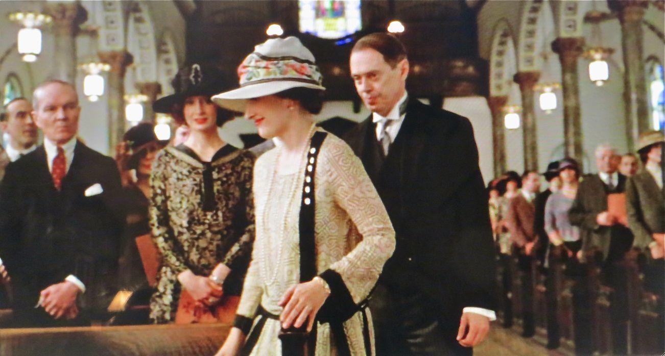 Standing in pew to right of picture holding program, celebrant at Enoch "Nucky" Thompson's award ceremony, wherein he is bestowed the title of Knight Commander of the Order of St. Gregory. "Bone for Tuna," Boardwalk Empire.  Shot in Brooklyn.  