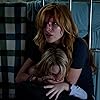 Bella Thorne and Mckenna Grace in Amityville: The Awakening (2017)