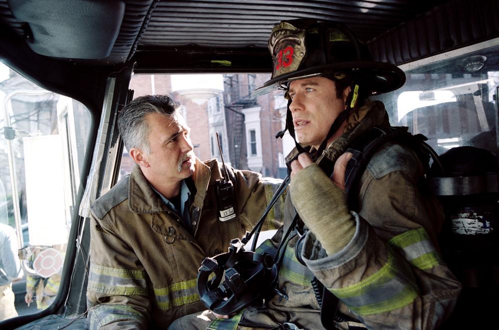 John Travolta and Mark Yant in Ladder 49 (2004)