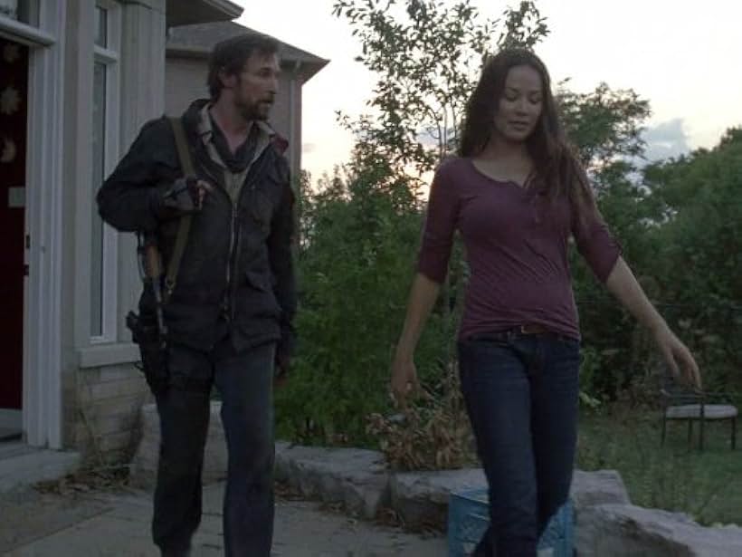 Noah Wyle and Moon Bloodgood in Falling Skies (2011)