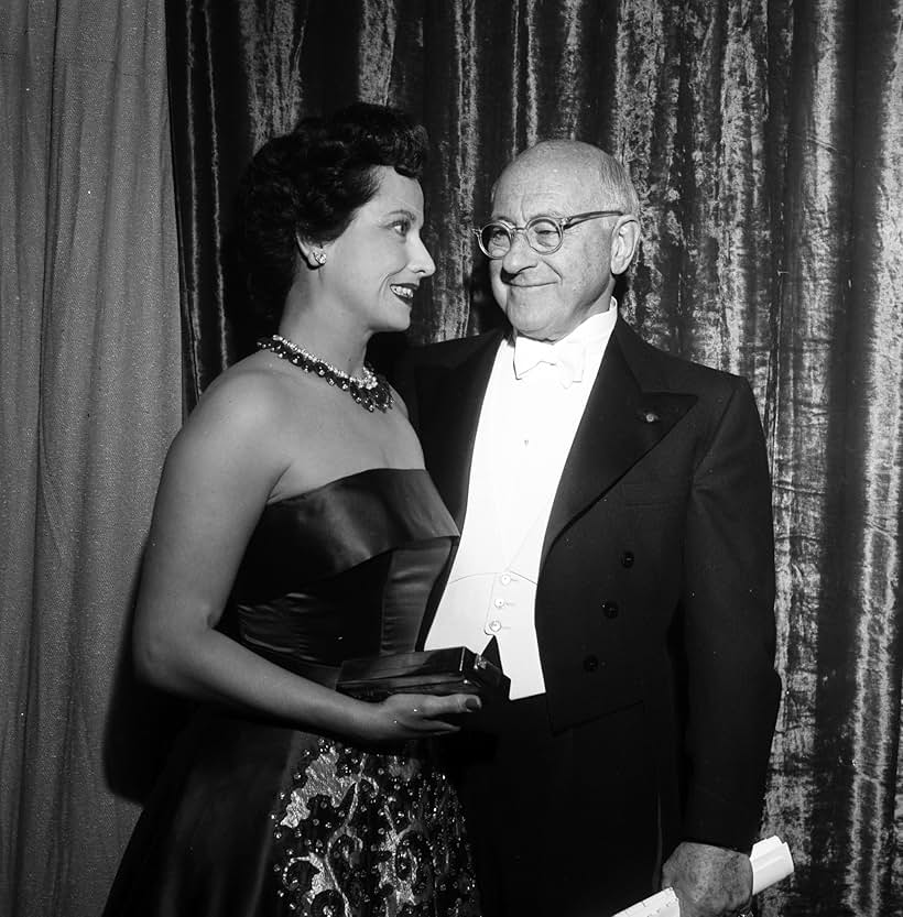 Cecil B. DeMille and Merle Oberon