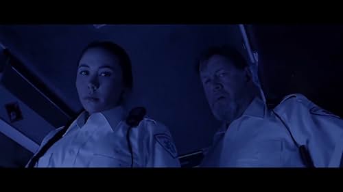 After a routine prison transfer crashes in the forest, young Inuit paramedic Melina finds herself surrounded by murderers with a mere 100 feet to climb out of a ditch to escape. When they are attacked by an unseen force in the forest, Melina's short journey to safety becomes the ultimate contest of wills.