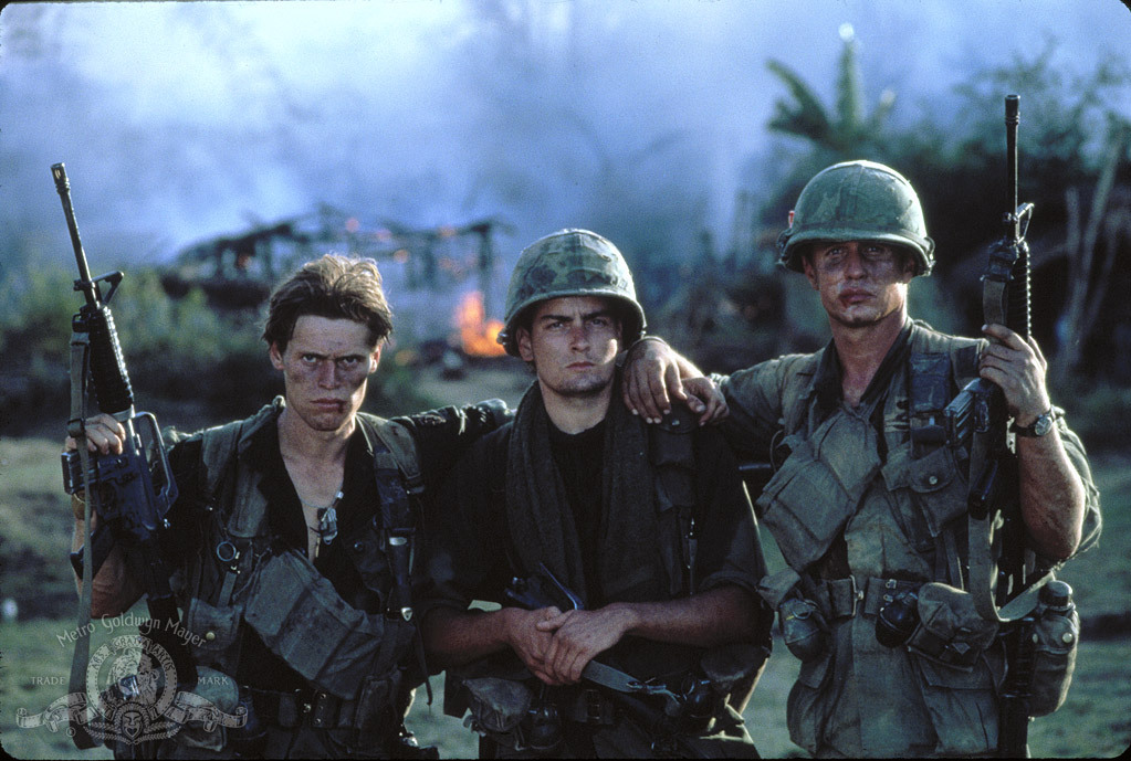 Charlie Sheen, Tom Berenger, and Willem Dafoe in Platoon (1986)