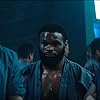 Tyler Jon Olson, Tyron Woodley, and Shea Buckner in Escape Plan 2: Hades (2018)