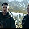 Tom Wilkinson and Owain Yeoman in SAS: Red Notice (2021)