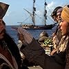 Johnny Depp, David Bailie, Kevin McNally, and Zoe Saldana in Pirates of the Caribbean: The Curse of the Black Pearl (2003)