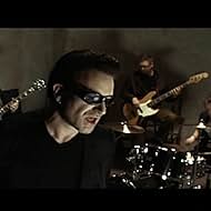 Bono, Adam Clayton, Larry Mullen Jr., The Edge, and U2 in U2: The Best of 1990-2000 (2002)