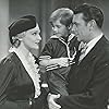 Scotty Beckett, George Brent, and Madeleine Carroll in The Case Against Mrs. Ames (1936)