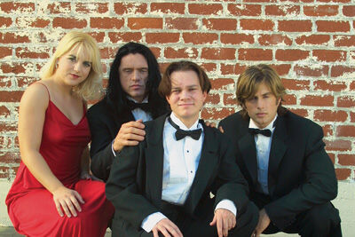 Greg Sestero, Philip Haldiman, Tommy Wiseau, and Juliette Danielle in The Room (2003)