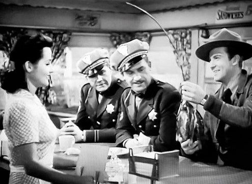 Pat Flaherty, William Lundigan, Brenda Marshall, and Frank Wilcox in Highway West (1941)