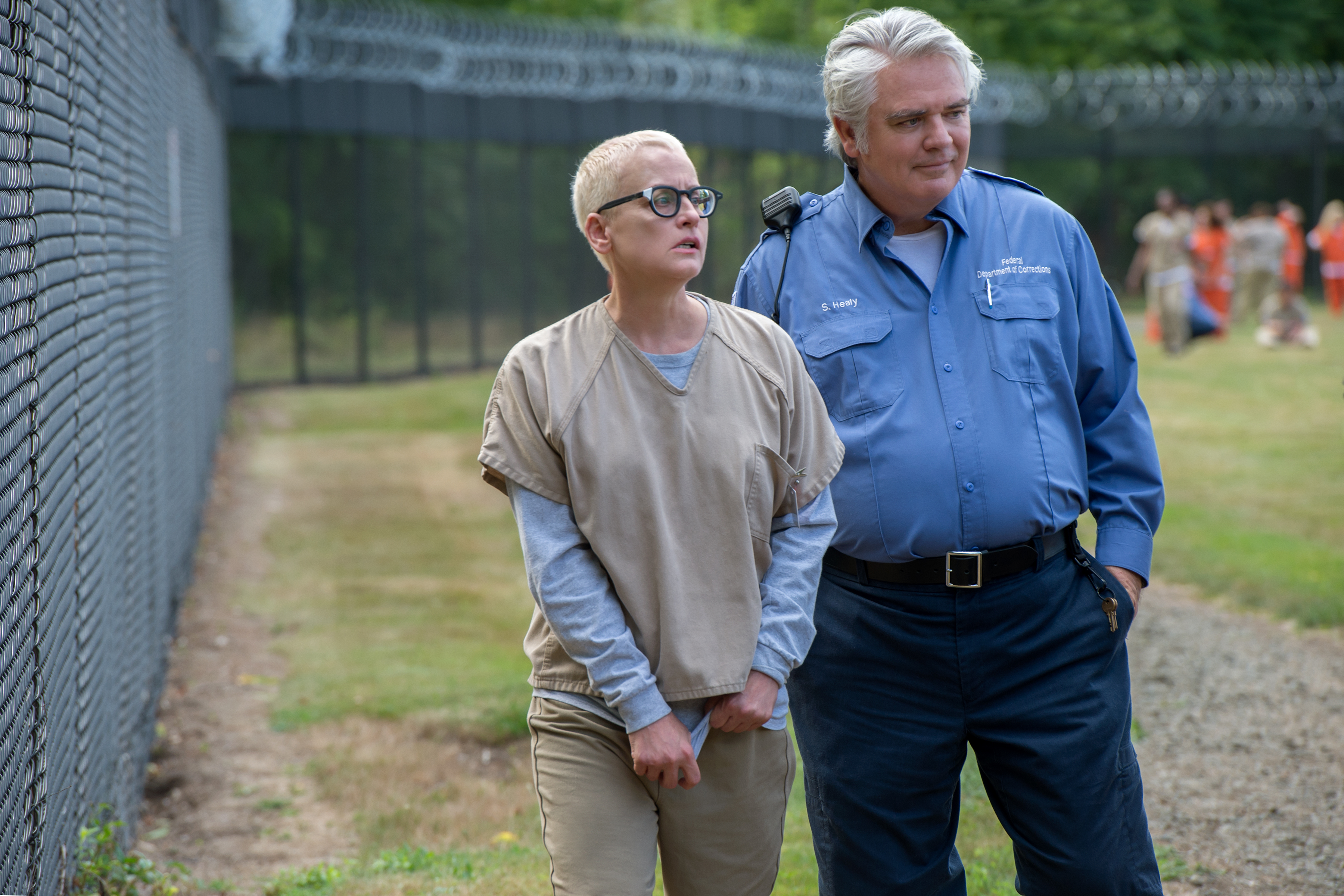 Lori Petty and Michael Harney in Orange Is the New Black (2013)