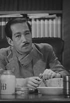 Tatsuo Saitô in What Did the Lady Forget? (1937)