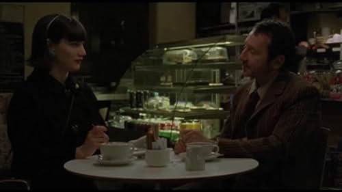 Zena (Megan Maczko) discusses her admiration for the down and out poet Bob (Michael Madsen) with the wealthy Jonny (Jean Hugues Anglade) and later dances with Bob....