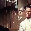 Guy Pearce, John Mahon, and Ron Rifkin in L.A. Confidential (1997)