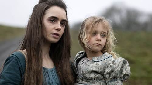 Mailow Defoy and Lily Collins in Les Misérables (2018)