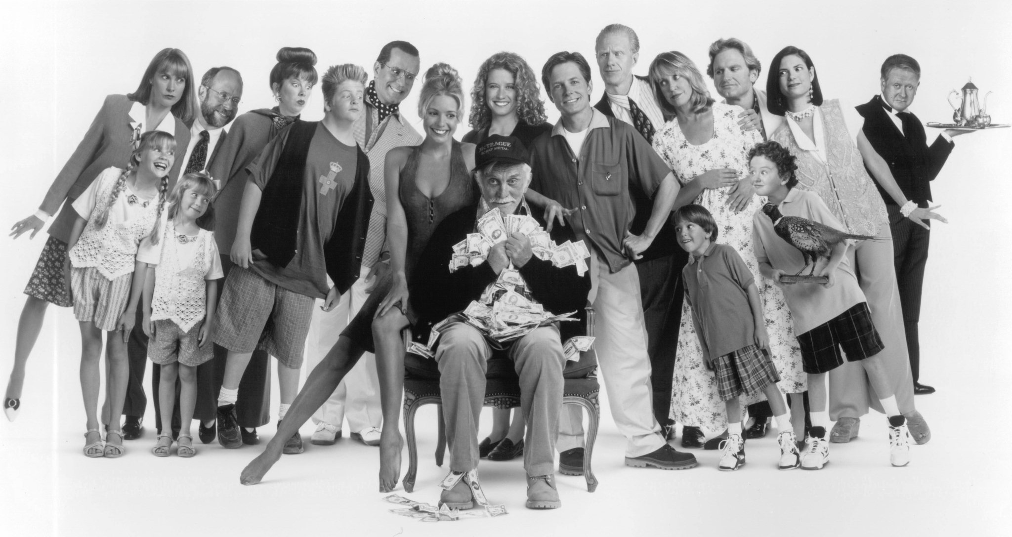 Kirk Douglas, Michael J. Fox, Kirsten Dunst, Bob Balaban, Ed Begley Jr., Nancy Travis, Olivia d'Abo, Eric Lloyd, Sean Babb, Jere Burns, Colleen Camp, Siobhan Fallon Hogan, Phil Hartman, Adam Hendershott, Joyce Hyser, Jonathan Lynn, Mary Ellen Trainor, and Lisa Bradley in Greedy (1994)