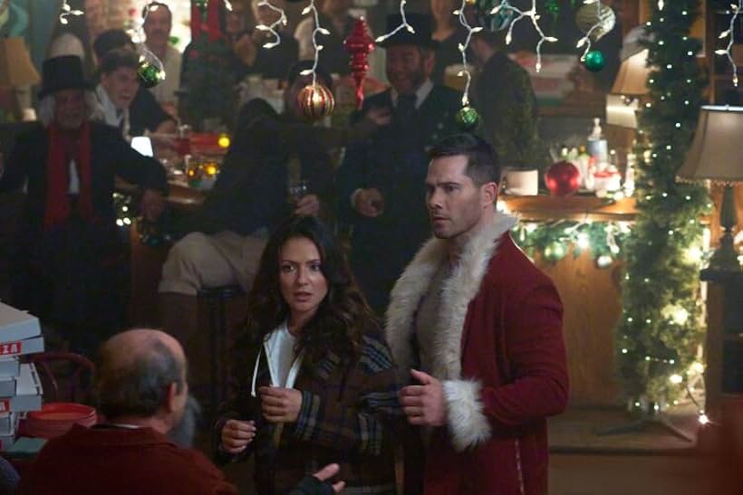 Luke Macfarlane and Italia Ricci in Catch Me If You Claus (2023)