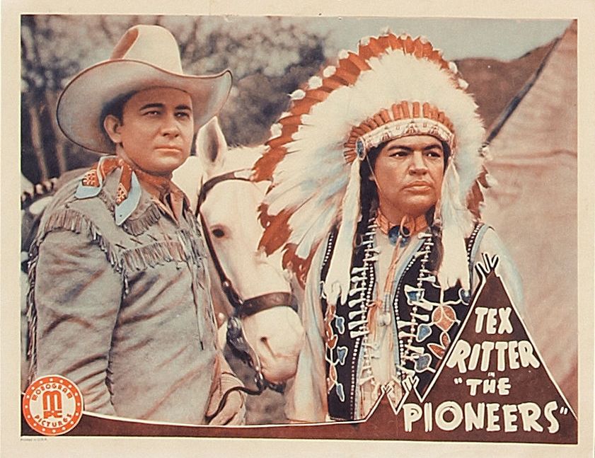 Tex Ritter and Charles Soldani in The Pioneers (1941)