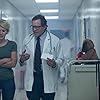 Steve Guttenberg and Nicky Whelan in Trauma Center (2019)