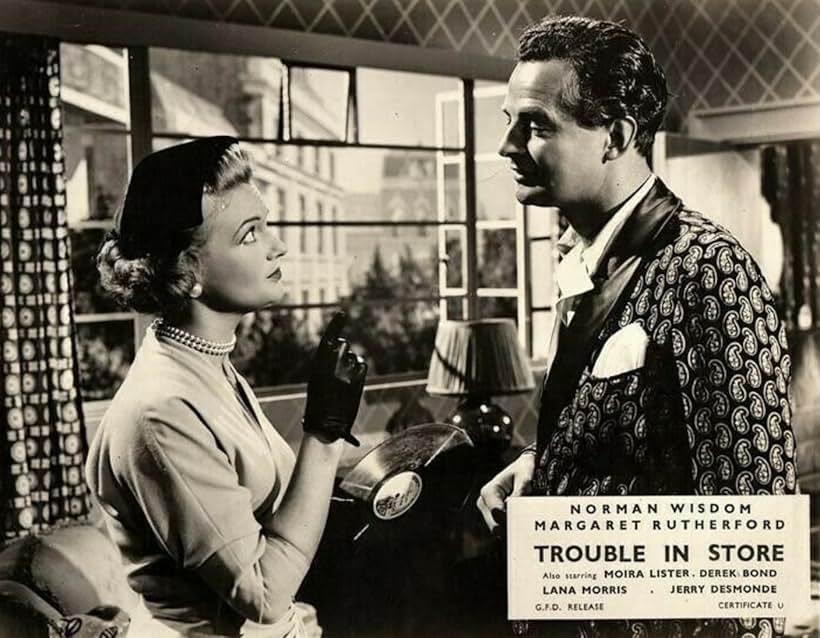 Derek Bond and Moira Lister in Trouble in Store (1953)